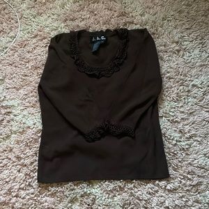 J.A.C. Long sleeve with frilly neck line and wrists
